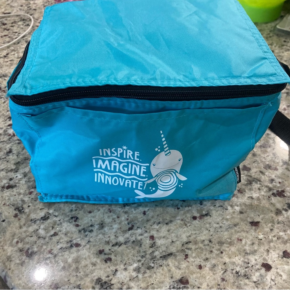 Preowned Koozie blue lunch bag with a Narwhal “Inspire Imagine Innovate” EUC